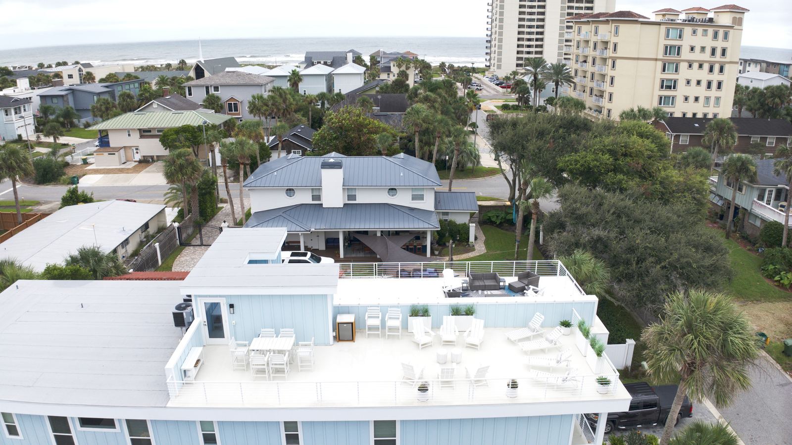 Aerial of the rental with the ocean behind it
