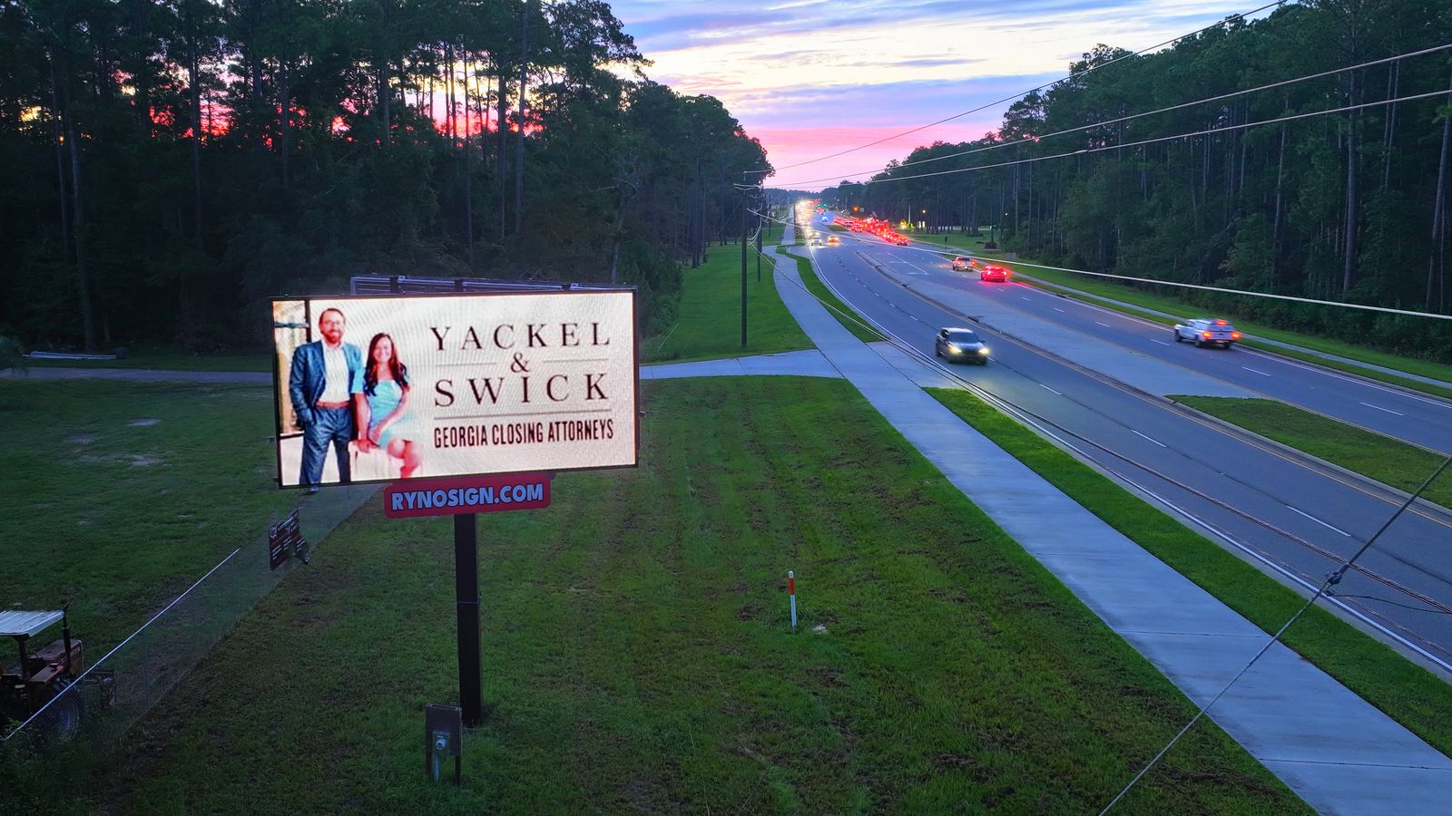 Billboard on a parkway with traffic
